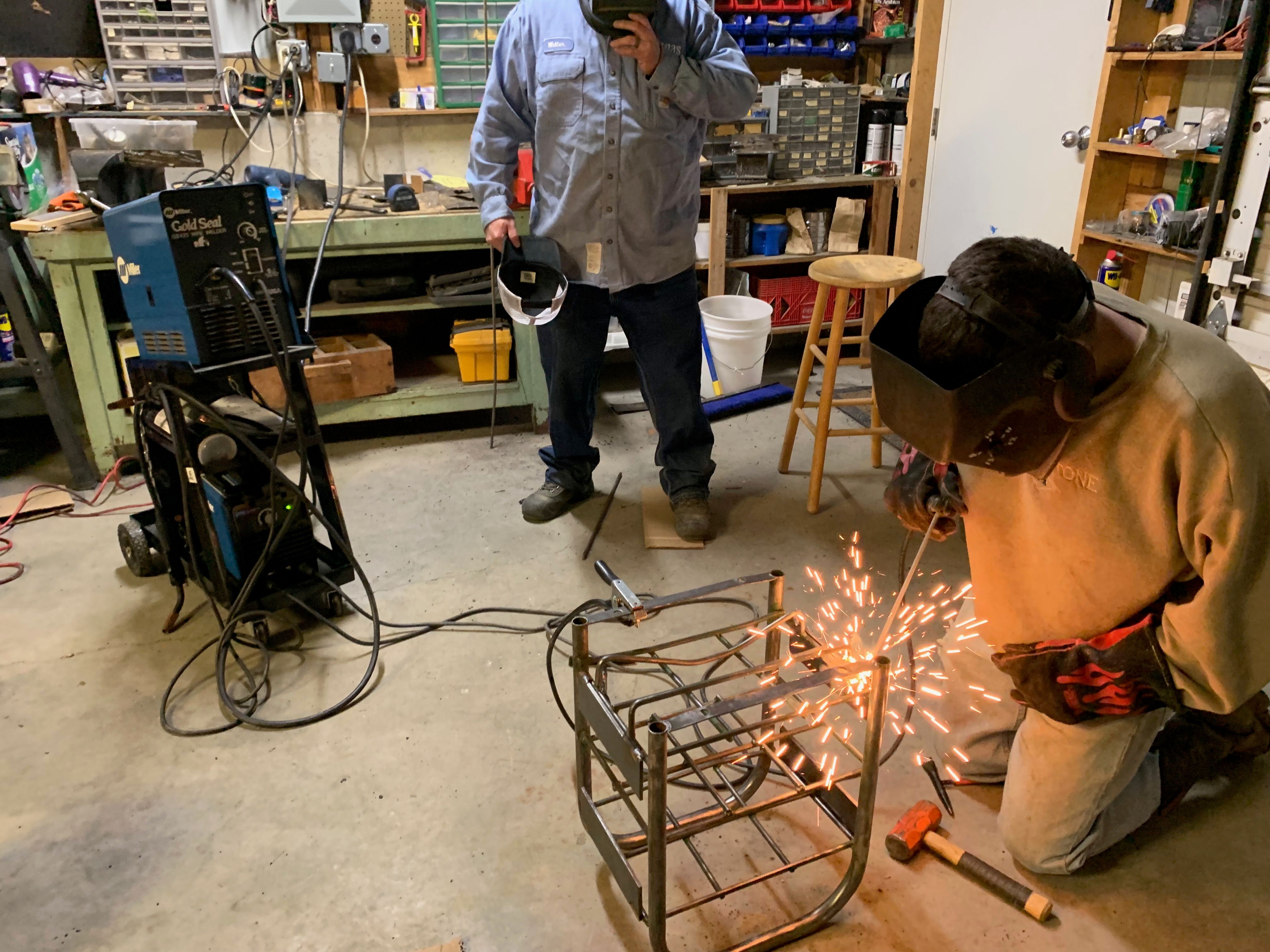 Jimmie welding his first commercial job - an equipment rack for a friend's delivery truck.