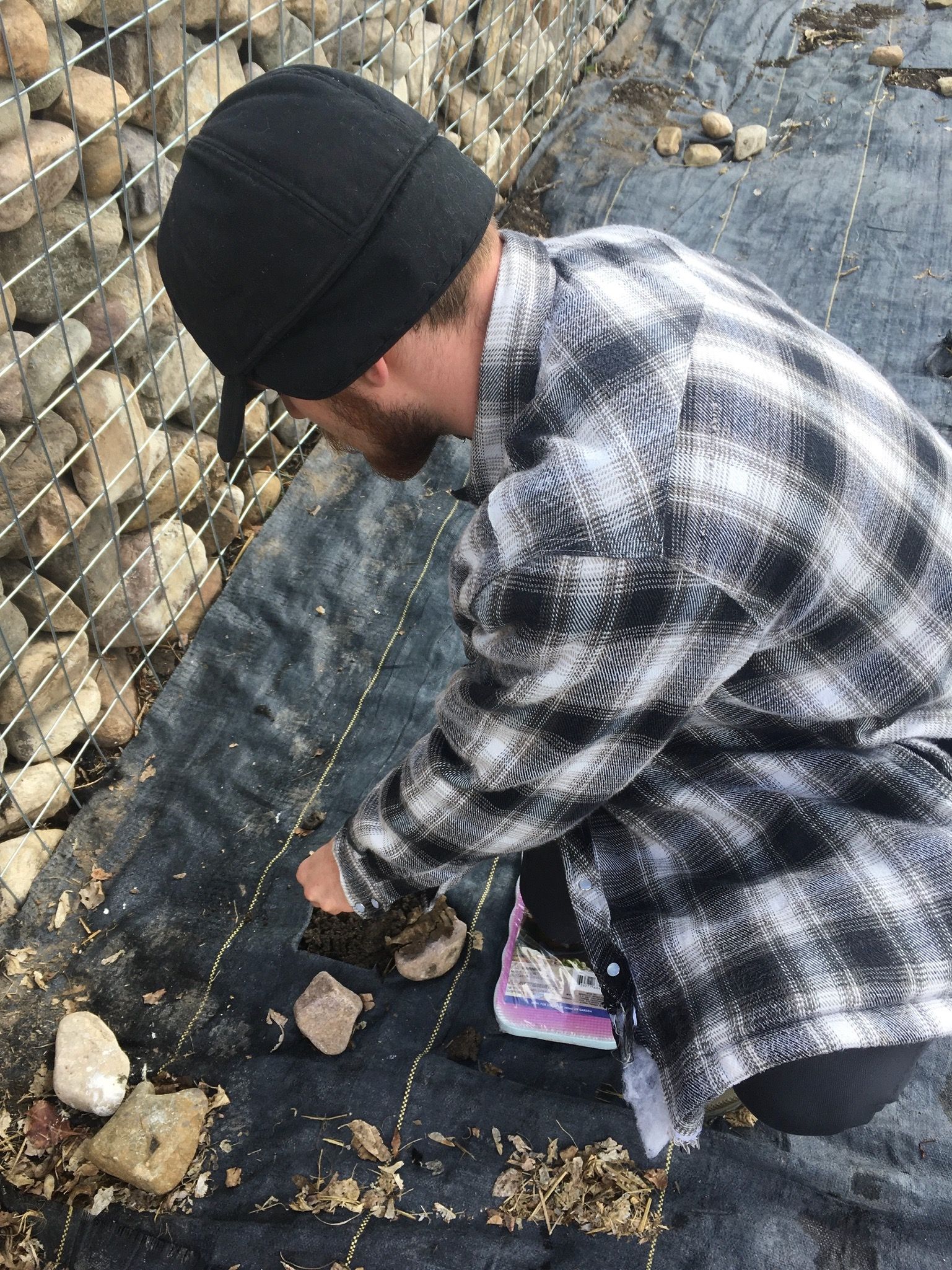 Derek planting in the garden outside the Greenhouse.
